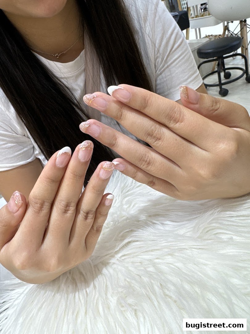 Elegant French Manicure with Gold Accents