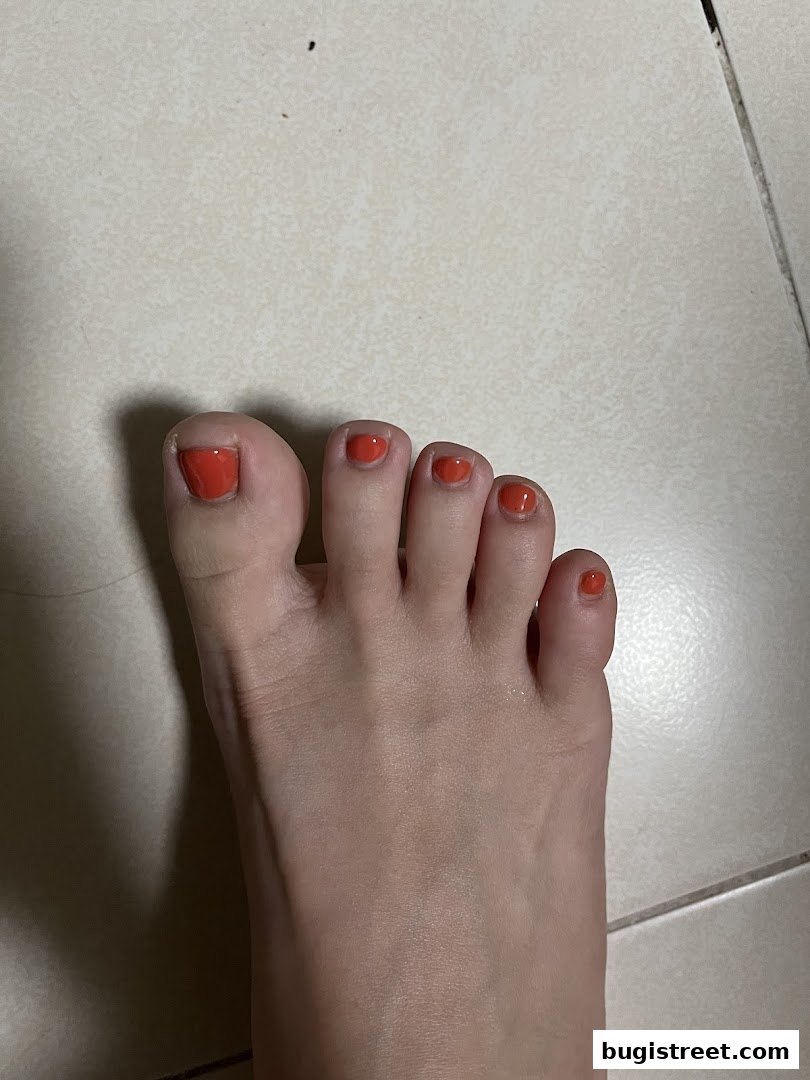 Vibrant Orange Toes at Angel Nail Lashes Studio