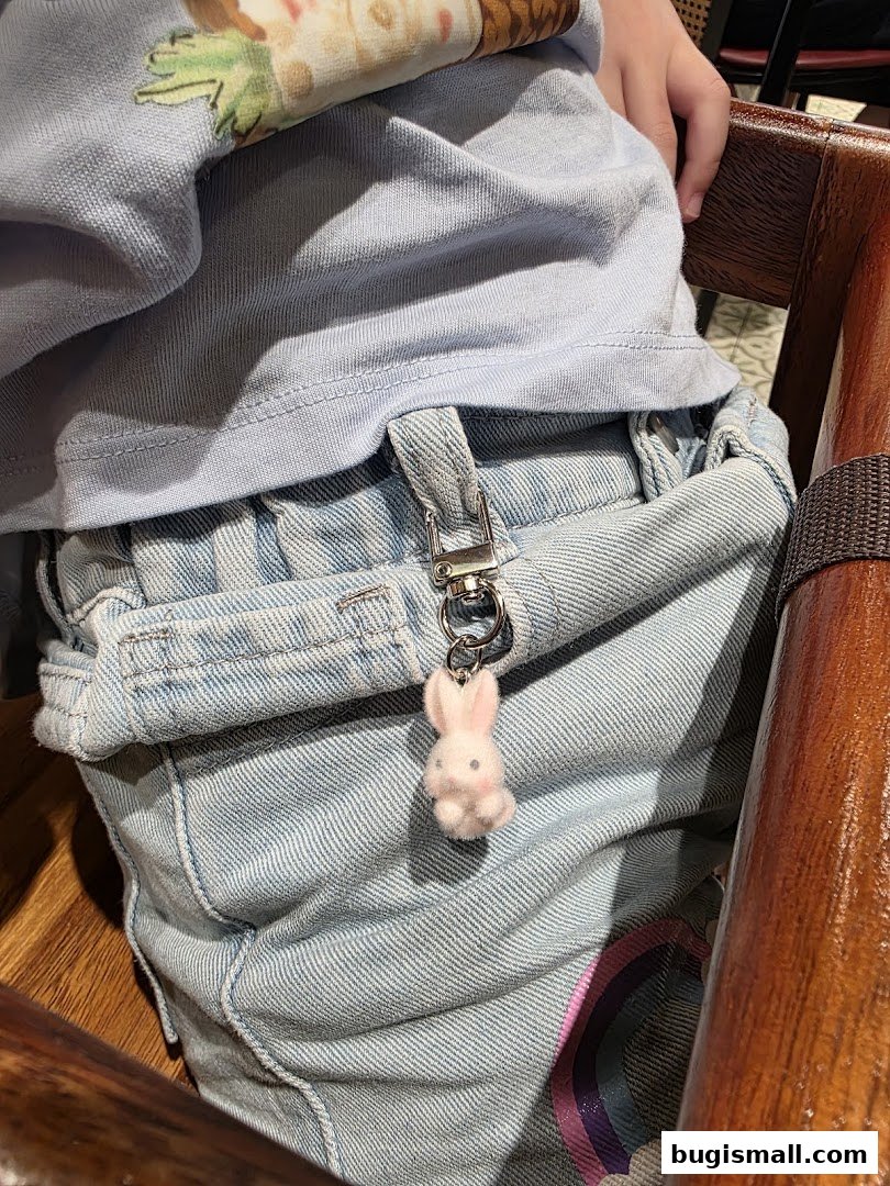 Adorable Bunny Keychain on Denim Overalls