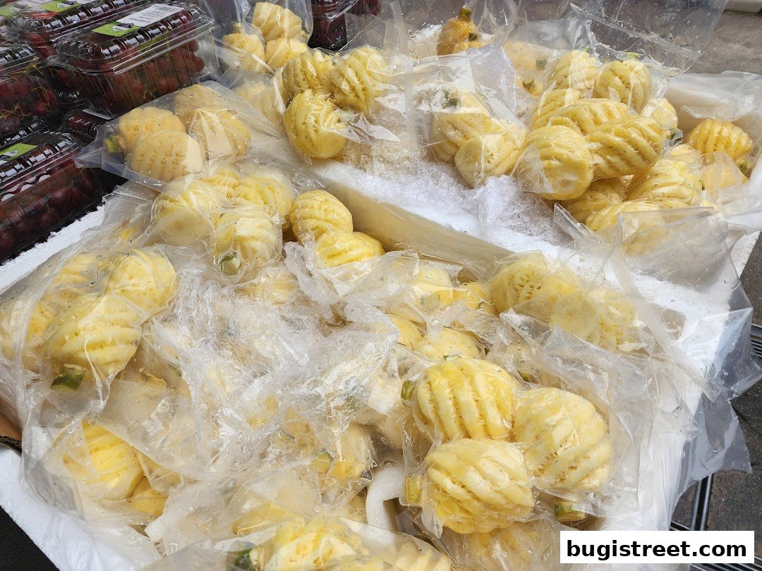 Freshly Peeled Pineapples & Grapes at Lian Hua Chun Fruits