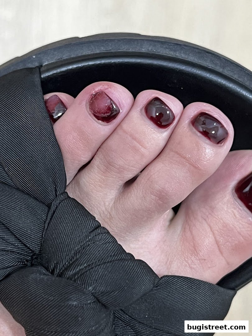Elegant Toes: Dark Red Nails & Chic Sandals