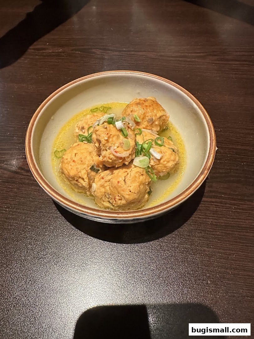 Savor Marutama Ramen's Flavorful Meatball Appetizer!