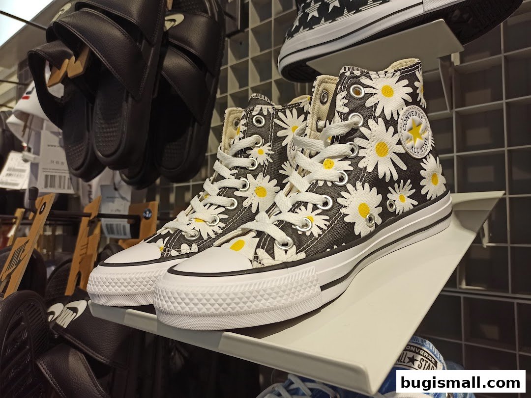Stylish Daisy Converse Sneakers on Display