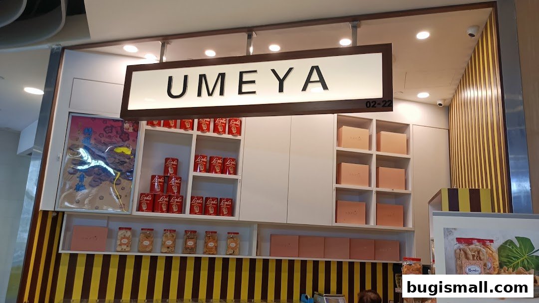 The Umeya shop front displays branded cans, boxes, and jars of snacks on shelves.