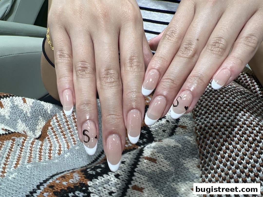 Elegant French Manicures with Custom Designs